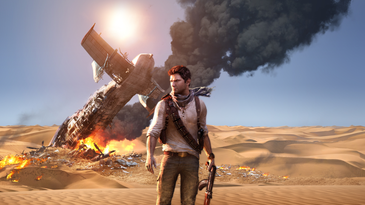 Drake nel deserto con un aereo in fiamme sullo sfondo