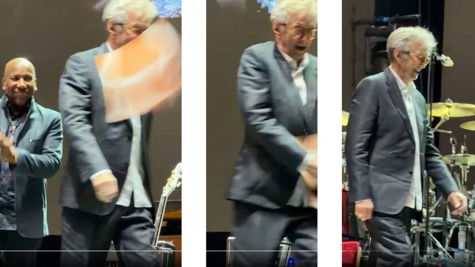 Eric Clapton viene colpito da un vinile durante un suo concerto